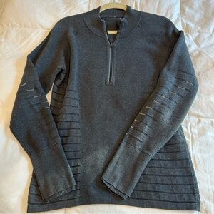 Lululemon grey sweater with thumb holes and reflective detail